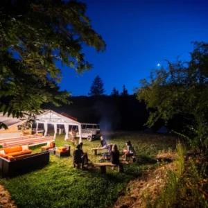 Outdoor dining area lit up at night
