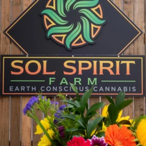 Sol Spirit Farm earth conscious cannabis sign with flowers