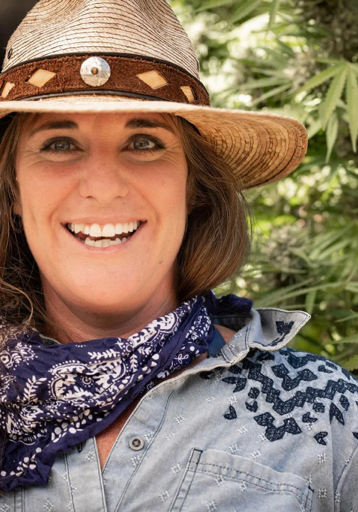 Smiling tour guide in a straw hat and bandana